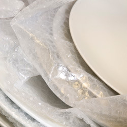 Keep Your Possessions Safe With These Winter Moving Tips plates wrapped with bubble wrap